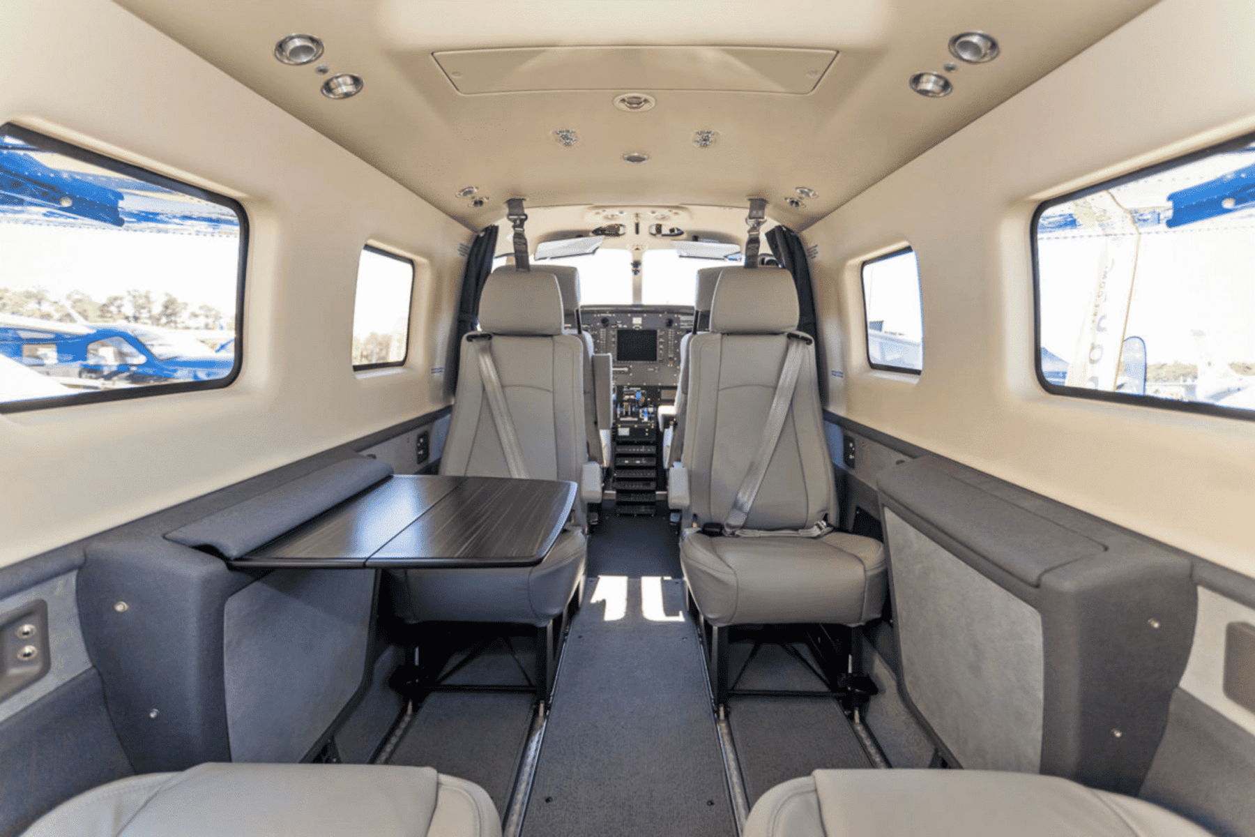Private plane interior with seats and table