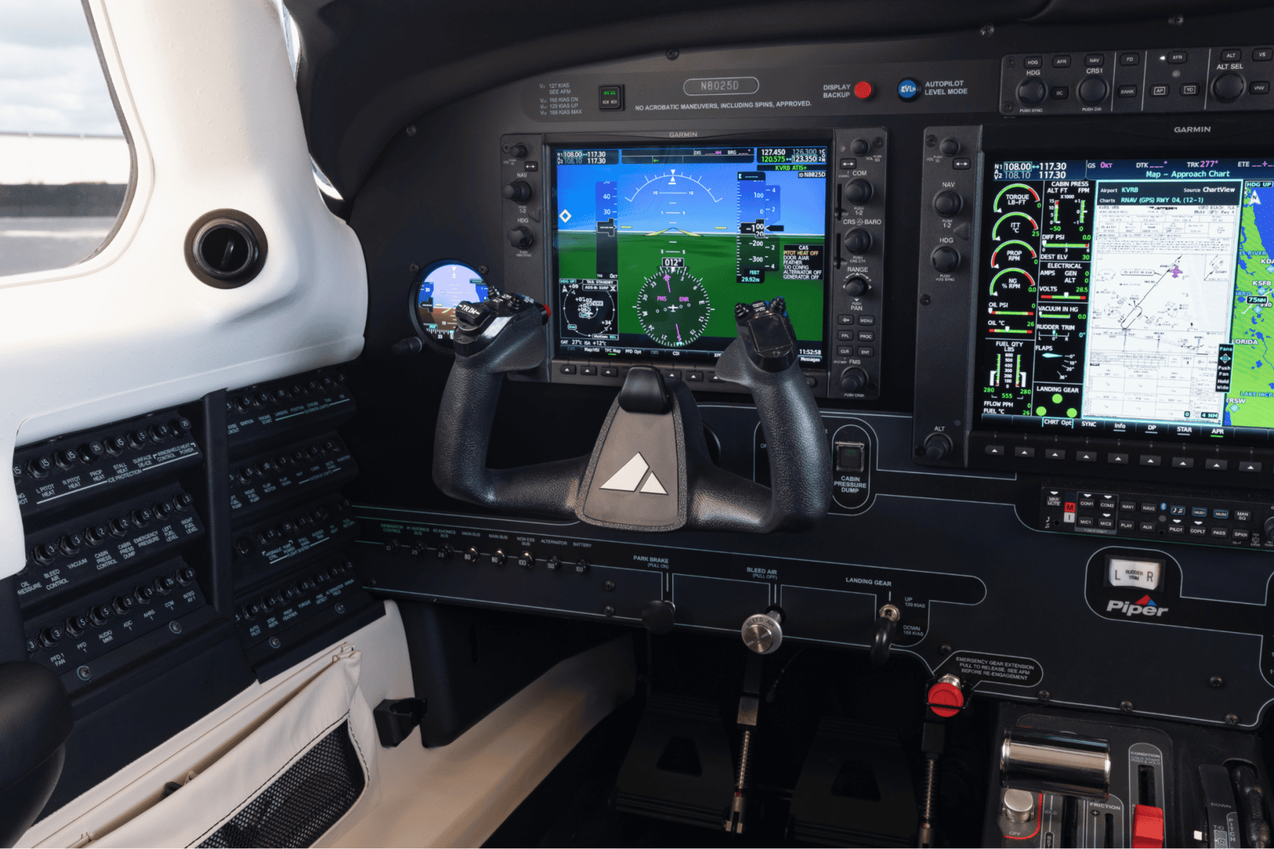 Modern airplane cockpit with digital flight displays.