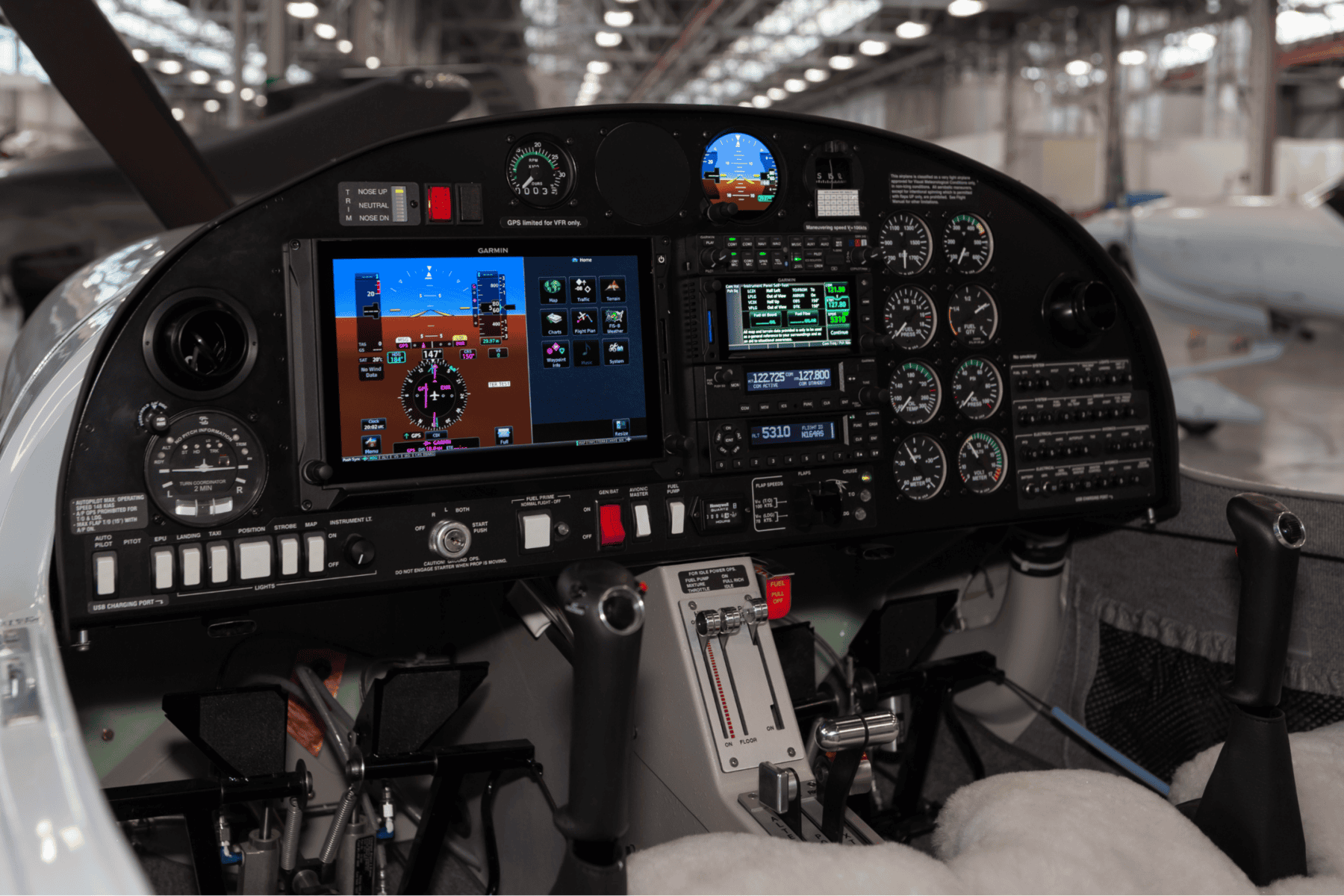 Airplane cockpit with dashboard instruments and controls.