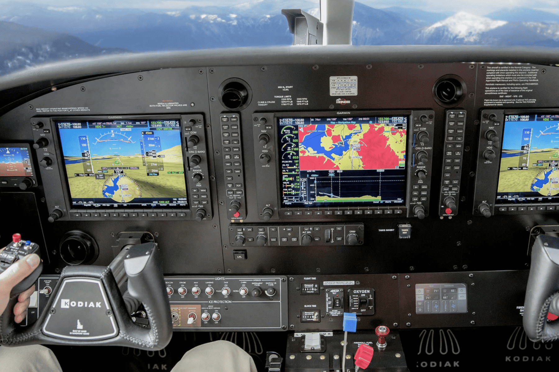 Aircraft cockpit showing multiple navigation displays.