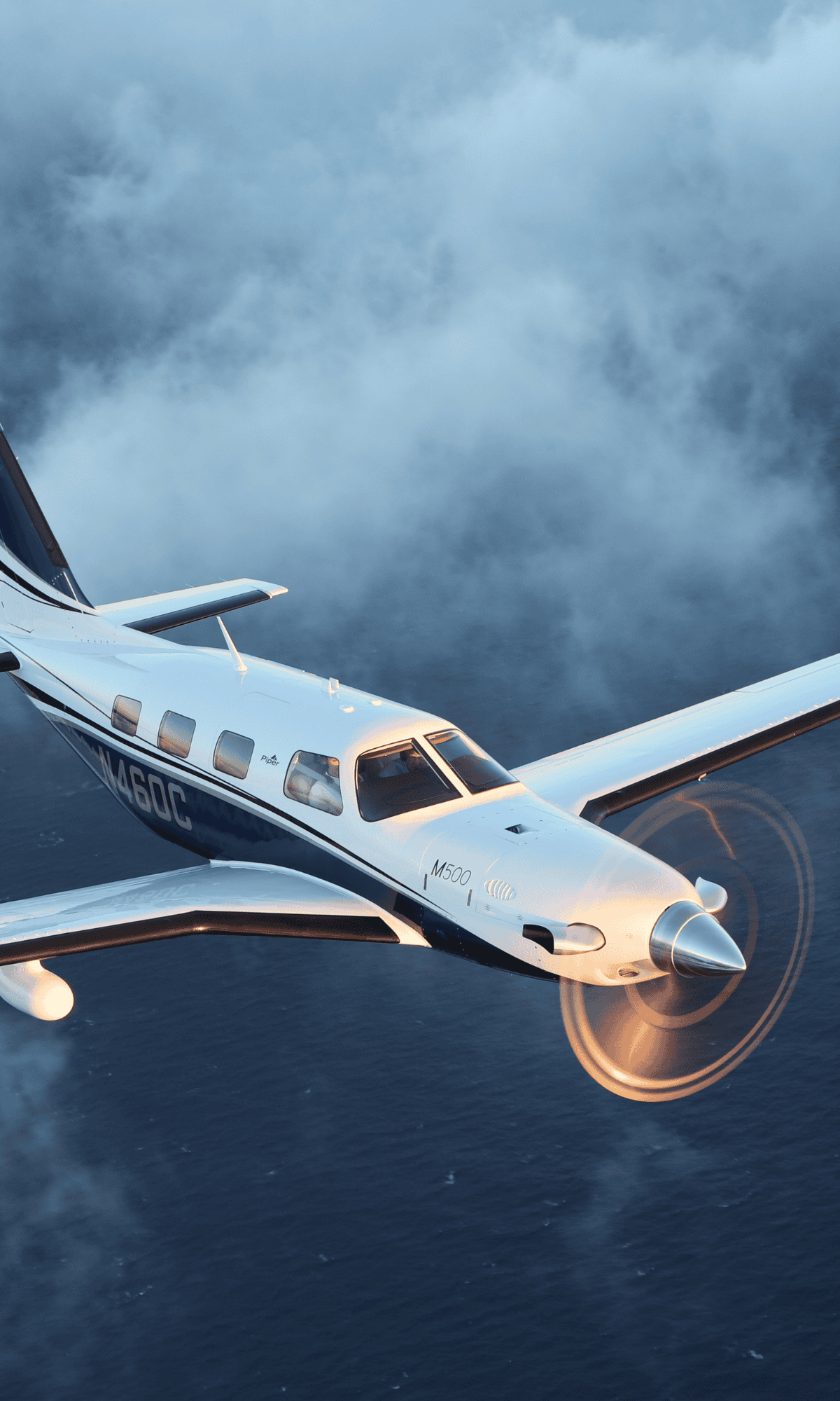 Small aircraft flying over ocean and clouds