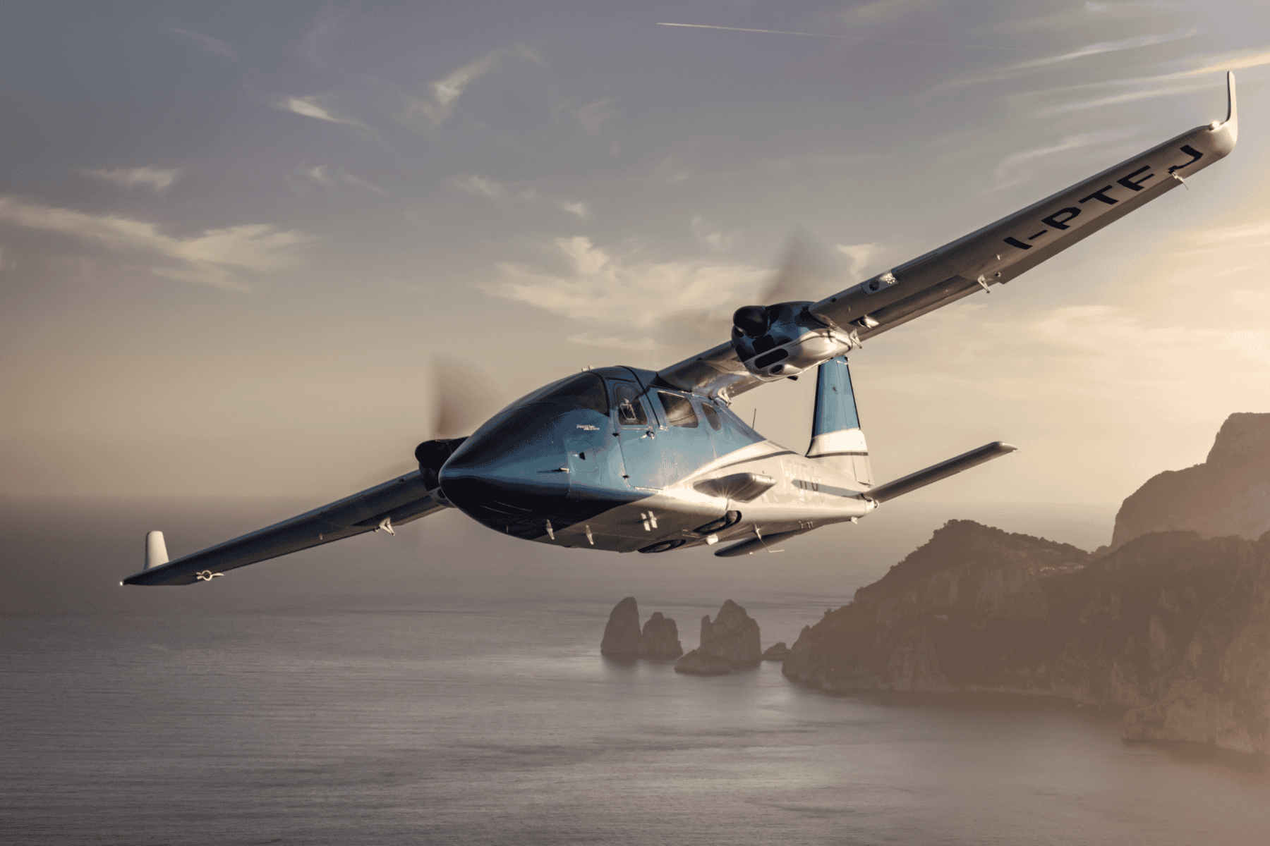 Plane flying over coastline at sunset