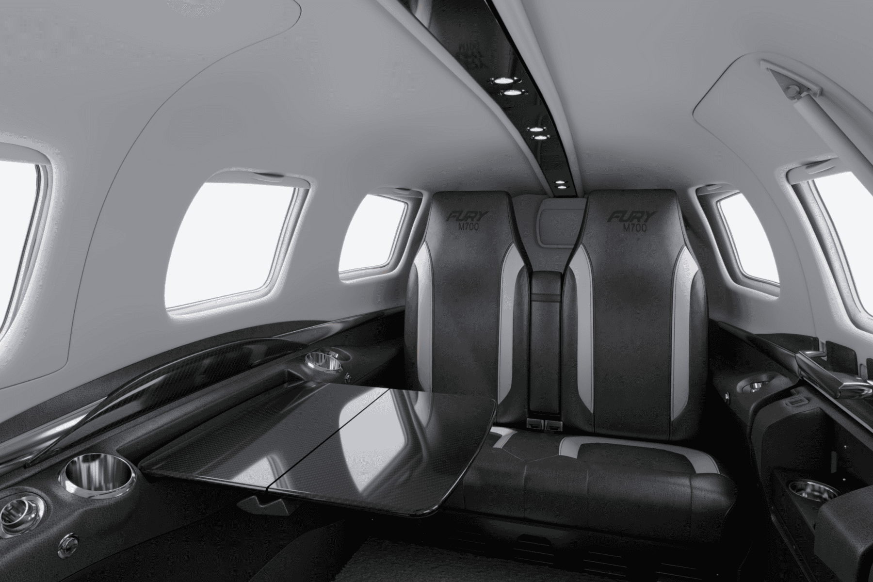 Luxury aircraft interior with leather seats and table.