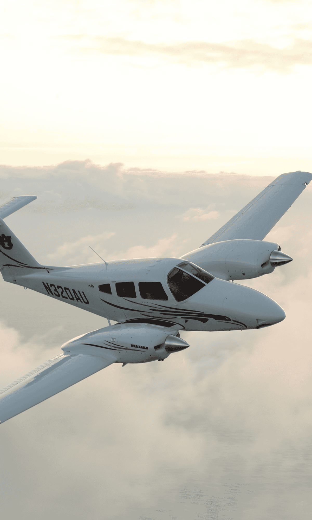 Small airplane flying above clouds at sunset.