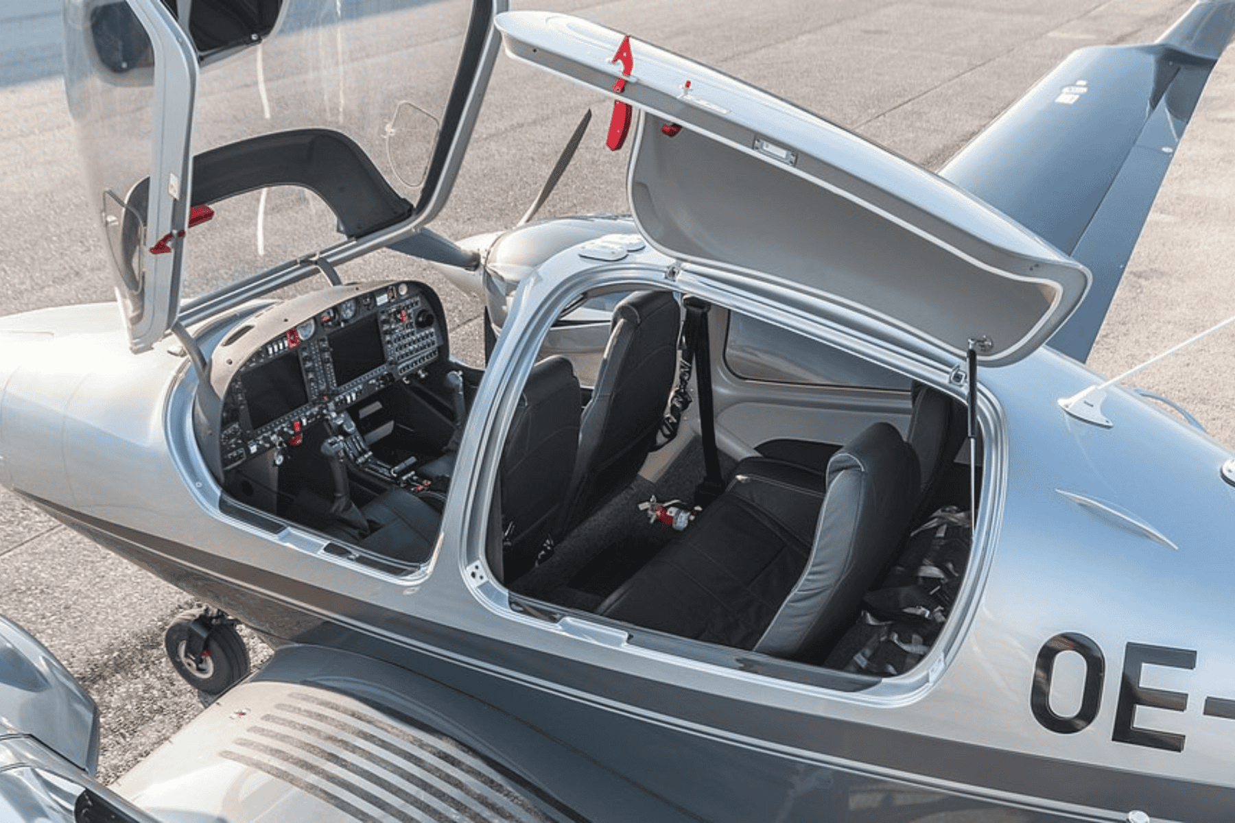 Open cockpit of small aircraft, overhead view.