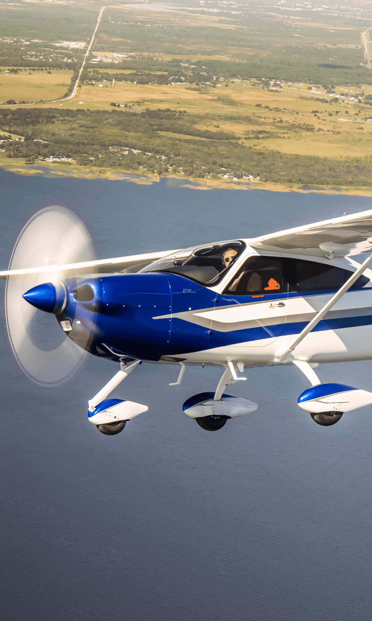 Blue and white airplane on runway