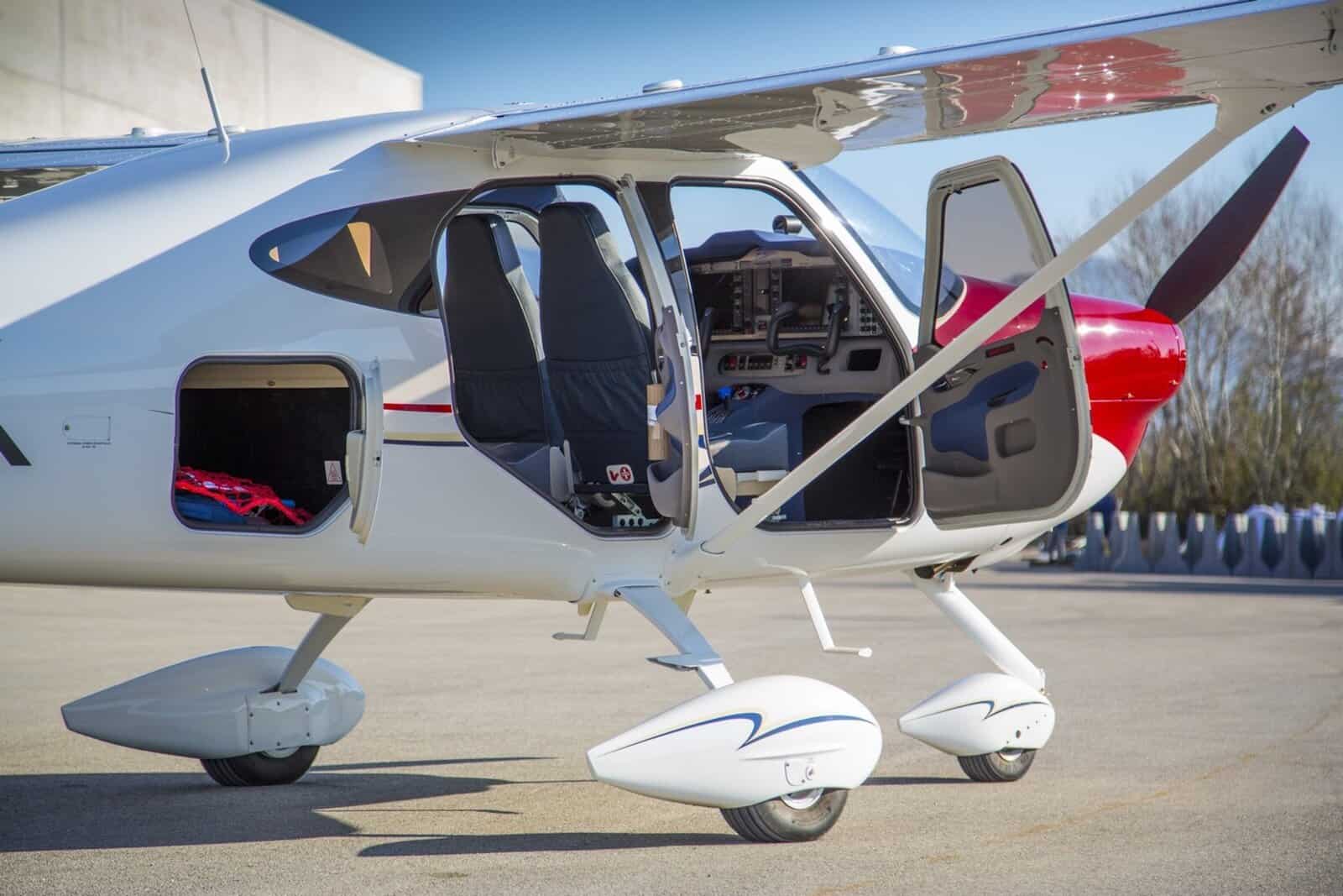 1200x800 sized images 1 Blue and white Cessna airplane flying over water.